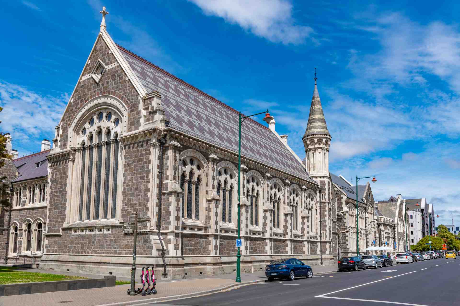 Historic stone church with Gothic-style architecture on a city street